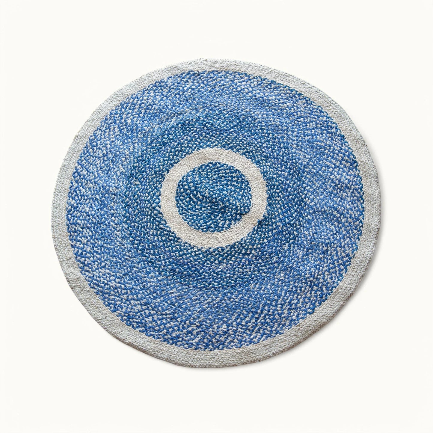 Handwoven medium round sisal rug marine blue variant with cream circle ring motif and light grey border on white background