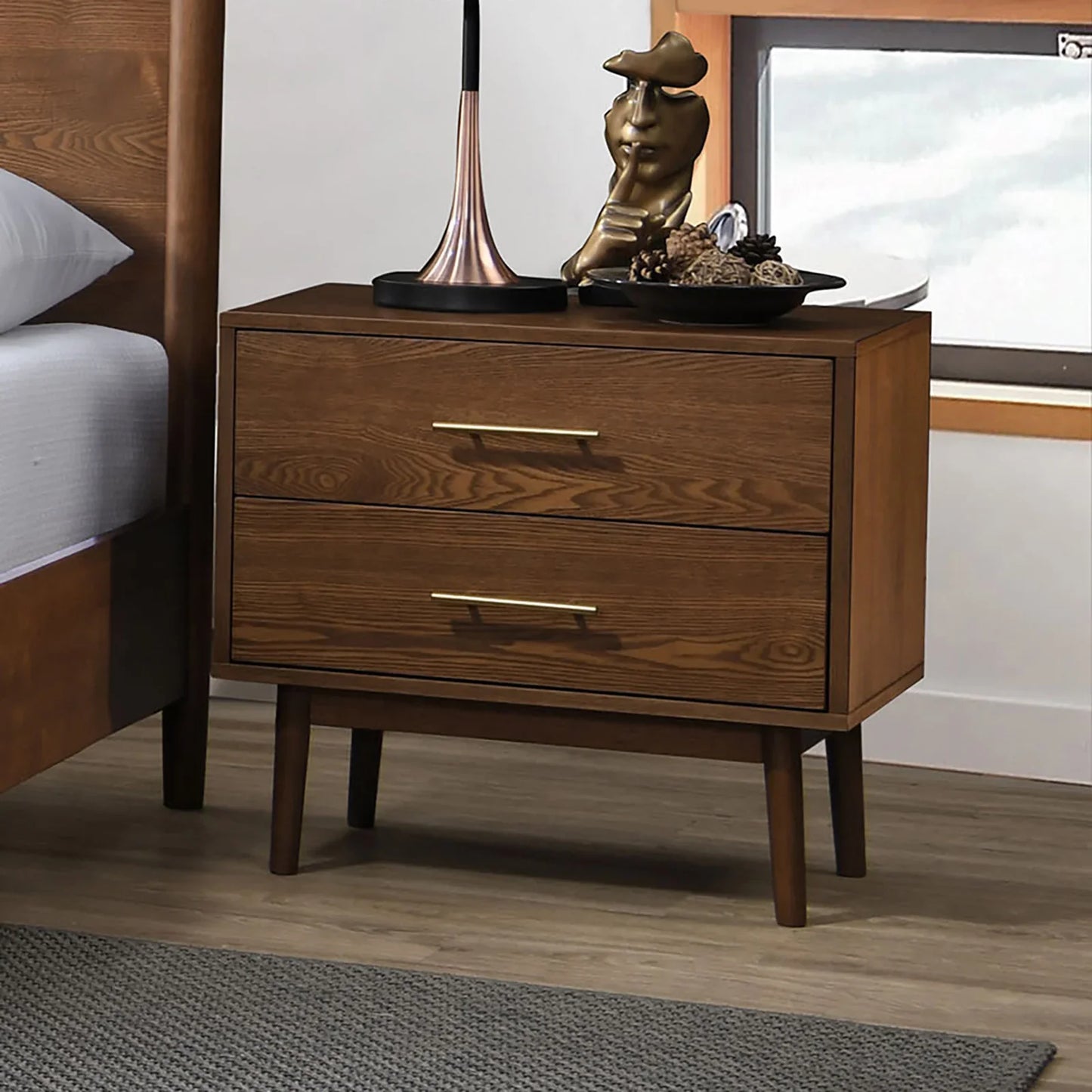 Mid-century walnut nightstand with tapered legs and gold bar pulls from the full bed set