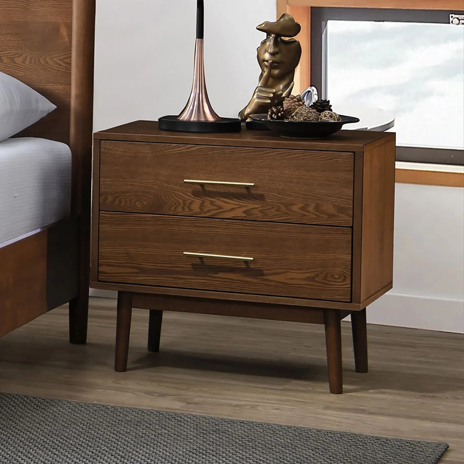Mid-century walnut nightstand with tapered legs and gold bar pulls from the full bed set