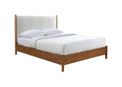 ​Mid-century modern full bed frame featuring a warm walnut wood base, tapered legs, and an elegant beige boucle upholstered panel headboard with white bedding