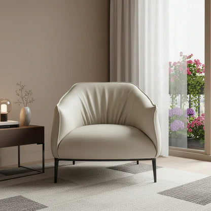 A modern faux leather arm chair in light gray with a black steel frame and recessed arms.
