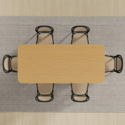 Top down birds eye view of a rectangular natural oak double pedestal dining table arranged with six woven cane chairs on a textured herringbone area rug