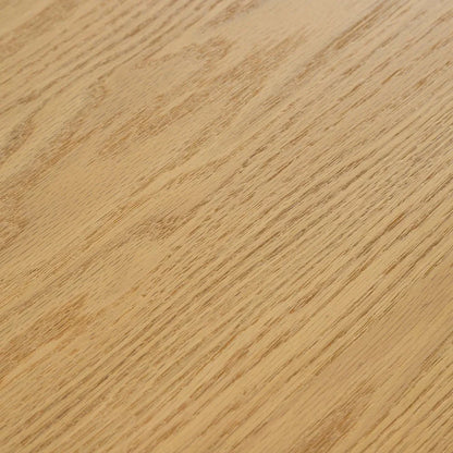 Extreme close up macro shot showing the fine natural wood grain textures and smooth light brown finish of a solid oak dining table surface