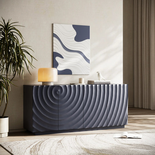 A modern lifestyle view of the Navy Blue Buffet Cabinet featuring a continuous 3D water ripple texture across four doors, set in a contemporary living area with a large potted plant and abstract wall art.