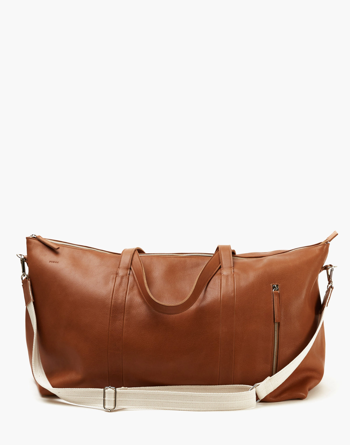 Malbec leather weekender bag in Tobacco with twin handles, a cream shoulder strap, top zipper, and vertical exterior zipper.