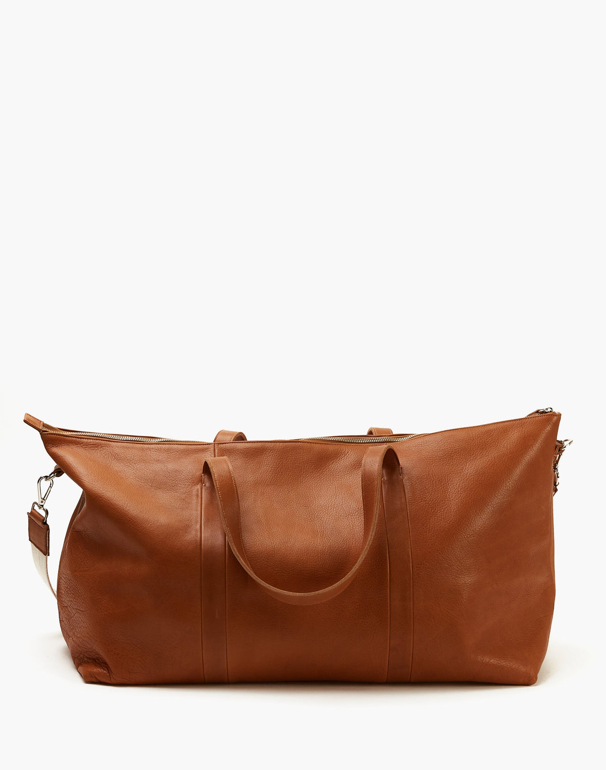 Rear view of the Malbec leather weekender in Tobacco, showing the leather grain, twin handles, vertical stitching, and top zipper.