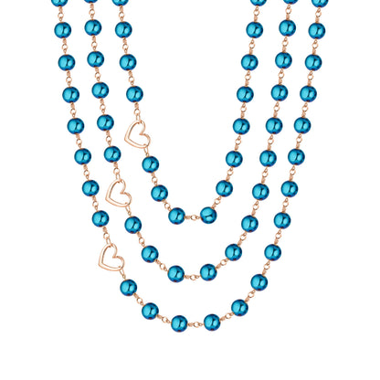 Celeste blue hematite layered necklace with three strands of reflective blue beads, copper-tone wirework, and three open heart accents on a white background.