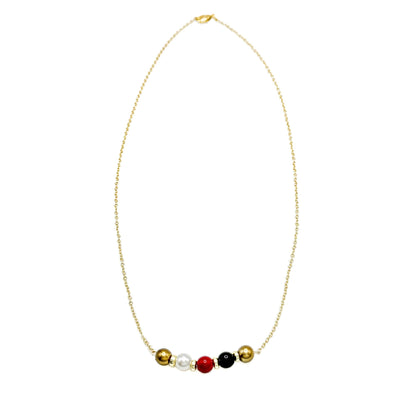 His-Story Majorca pearl bar necklace with five gold, white, red, black, and gold pearls on a gold-plated chain, shown on a white background.