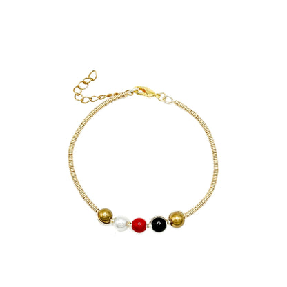 His-Story Majorca pearl beaded bangle bracelet with gold-tone wire wrapping, gold, white, red, and black beads, a lobster clasp, and an extender chain on a white background.