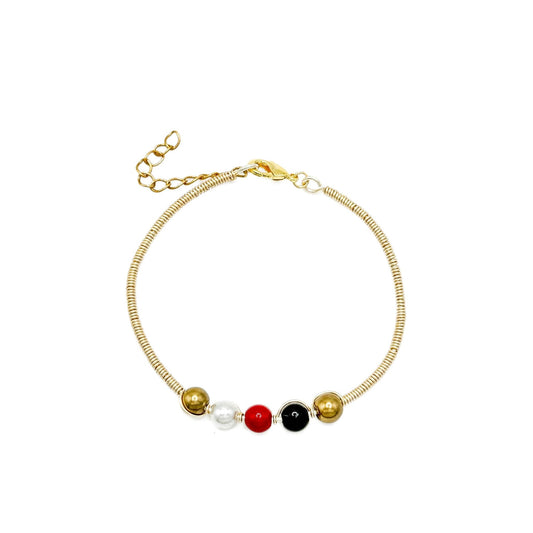 His-Story Majorca pearl beaded bangle bracelet with gold-tone wire wrapping, gold, white, red, and black beads, a lobster clasp, and an extender chain on a white background.