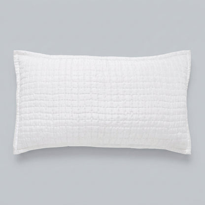 Front view of the Malibu Pearl rectangular silk pillow sham, showing its soft off-white tone, square pick-stitch quilting, and smooth border against a gray background.