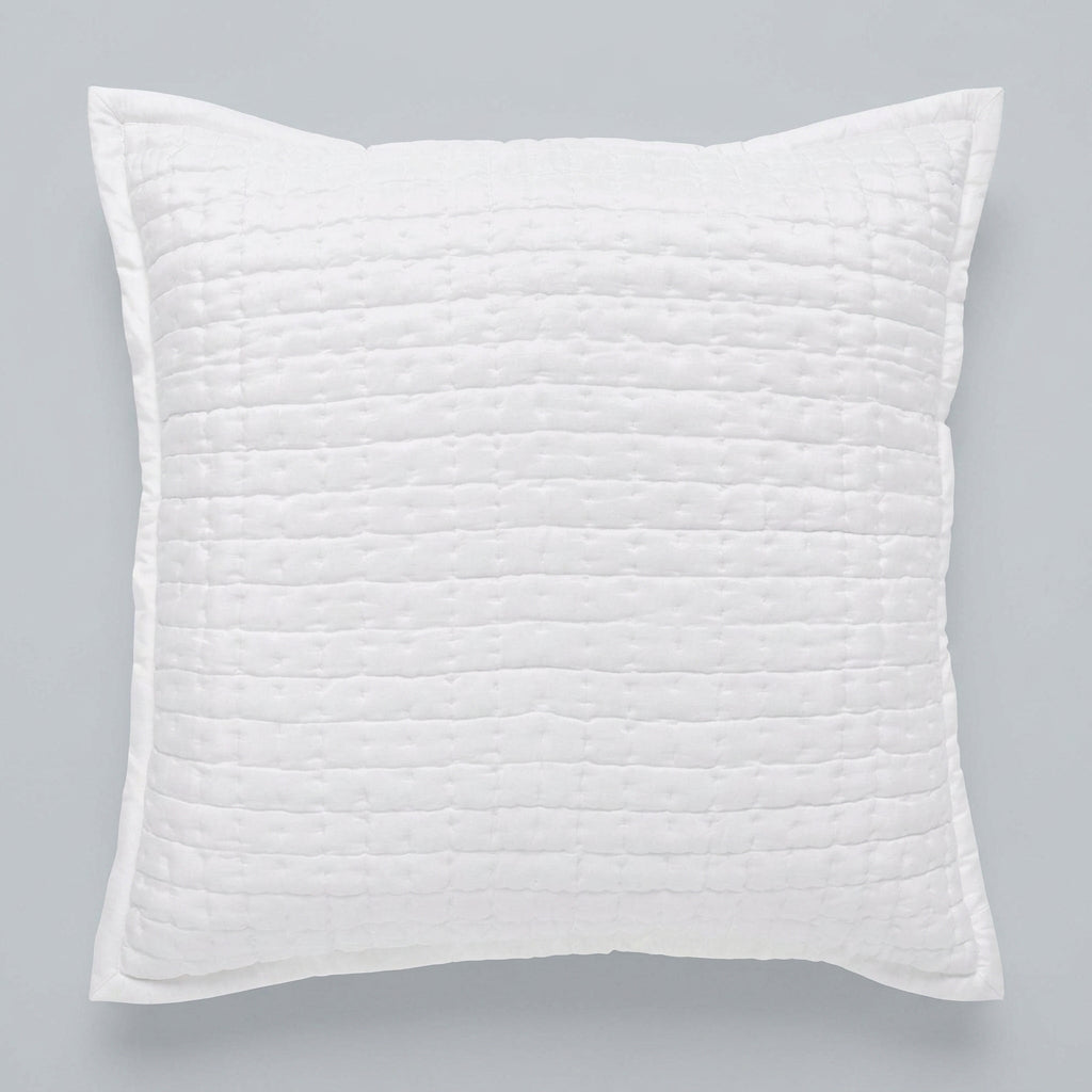 Front view of the Malibu Pearl square silk pillow sham, showing its soft off-white tone, pick-stitch quilting, and smooth fabric border against a gray background.