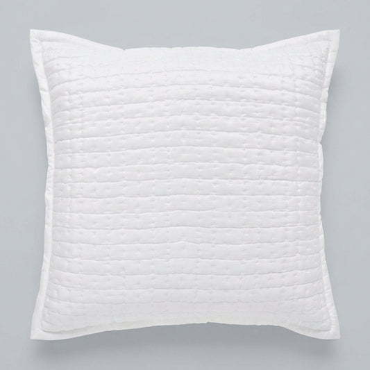 Front view of the Malibu Pearl square silk pillow sham, showing its soft off-white tone, pick-stitch quilting, and smooth fabric border against a gray background.