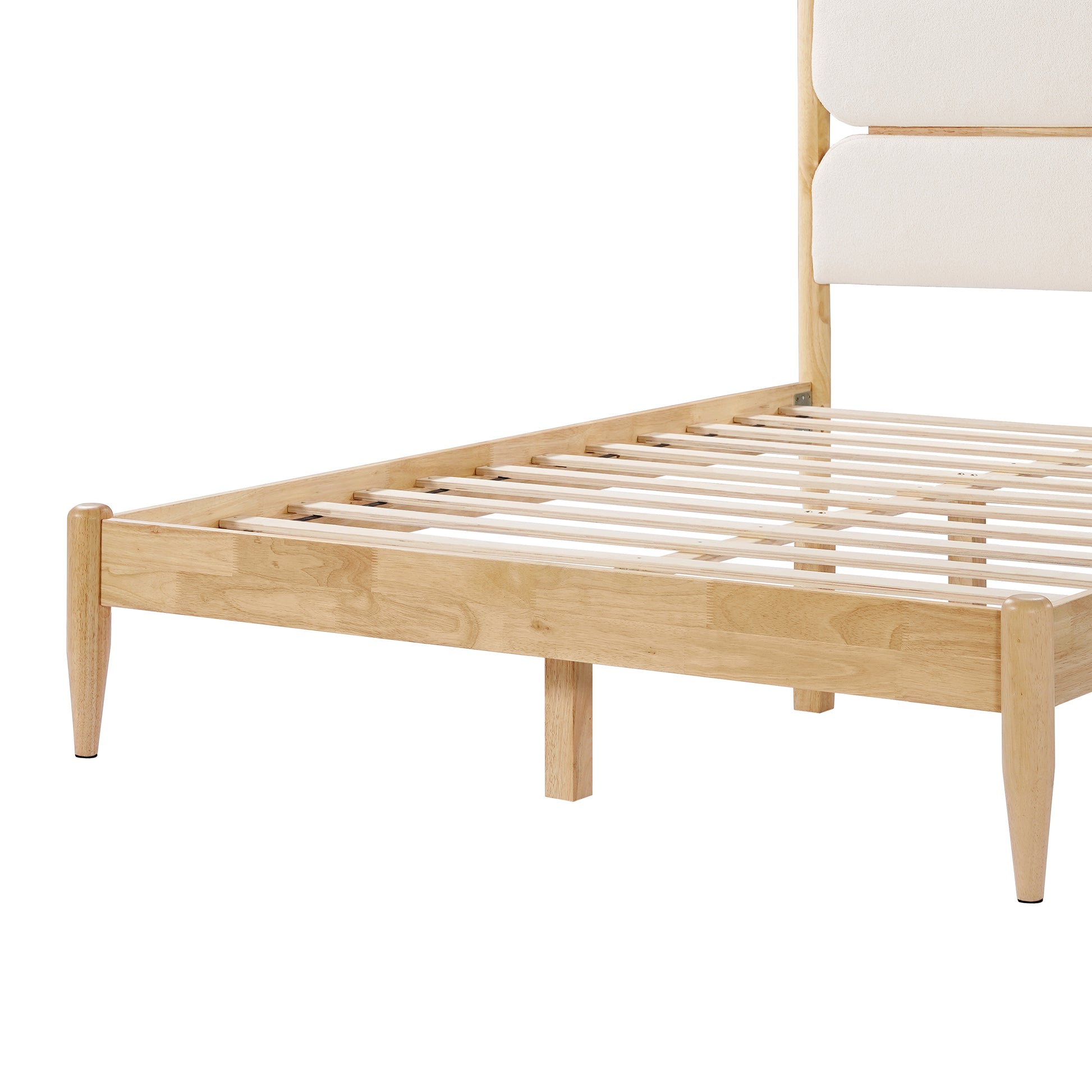  A high-resolution close-up of the Queen Platform Bed showcasing the smooth, tapered solid wood leg and the precision corner joinery of the Durable Rubberwood Frame in a natural finish.
