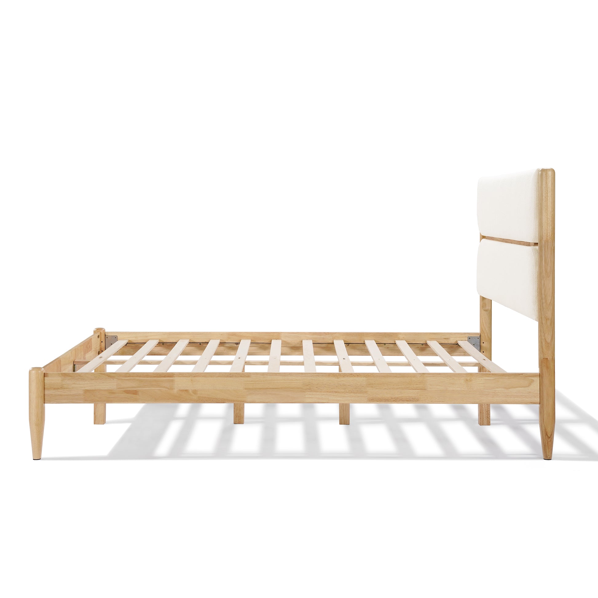A detailed close-up of the Queen Platform Bed headboard, highlighting the dual-panel design upholstered in soft Ivory Fleece Furniture fabric with a visible Durable Rubberwood Frame support. 