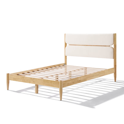 A close-up view of a Queen Platform Bed highlighting the plush ivory fleece headboard with dual-panel cushioning and a Durable Rubberwood Frame.