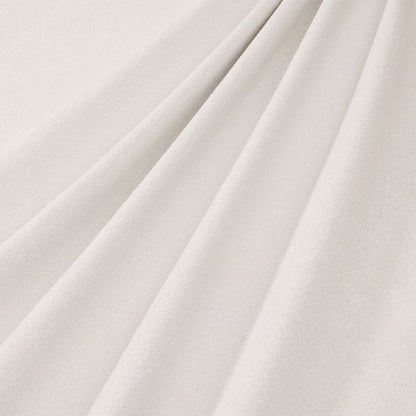A high-resolution close-up of the Ivory Fleece Furniture upholstery, showcasing the soft, breathable, and textured fabric used on the Queen Platform Bed headboard panels.