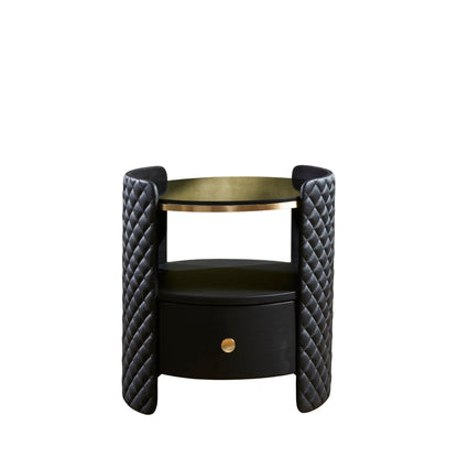 Quilted Round Leather Nightstand black front view diamond quilting brass rim drawer white background product shot