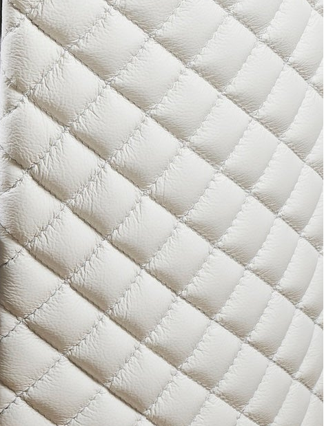 Quilted Round Leather Nightstand white genuine leather diamond quilting close detail side panel texture 