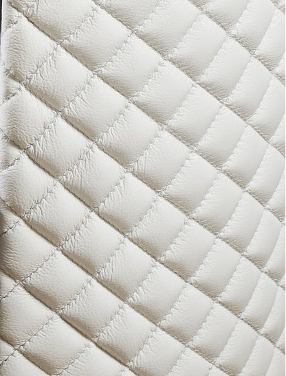 Quilted Round Leather Nightstand white genuine leather diamond quilting close detail side panel texture 