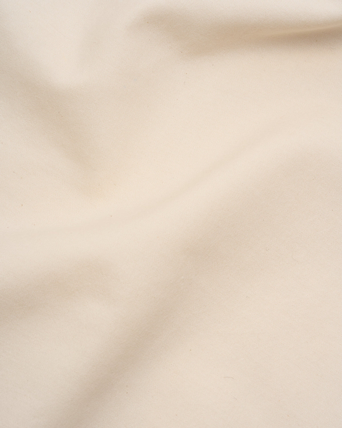 Signature Milk Fibre Core Set Cream casein fabric closeup showing smooth lightweight texture