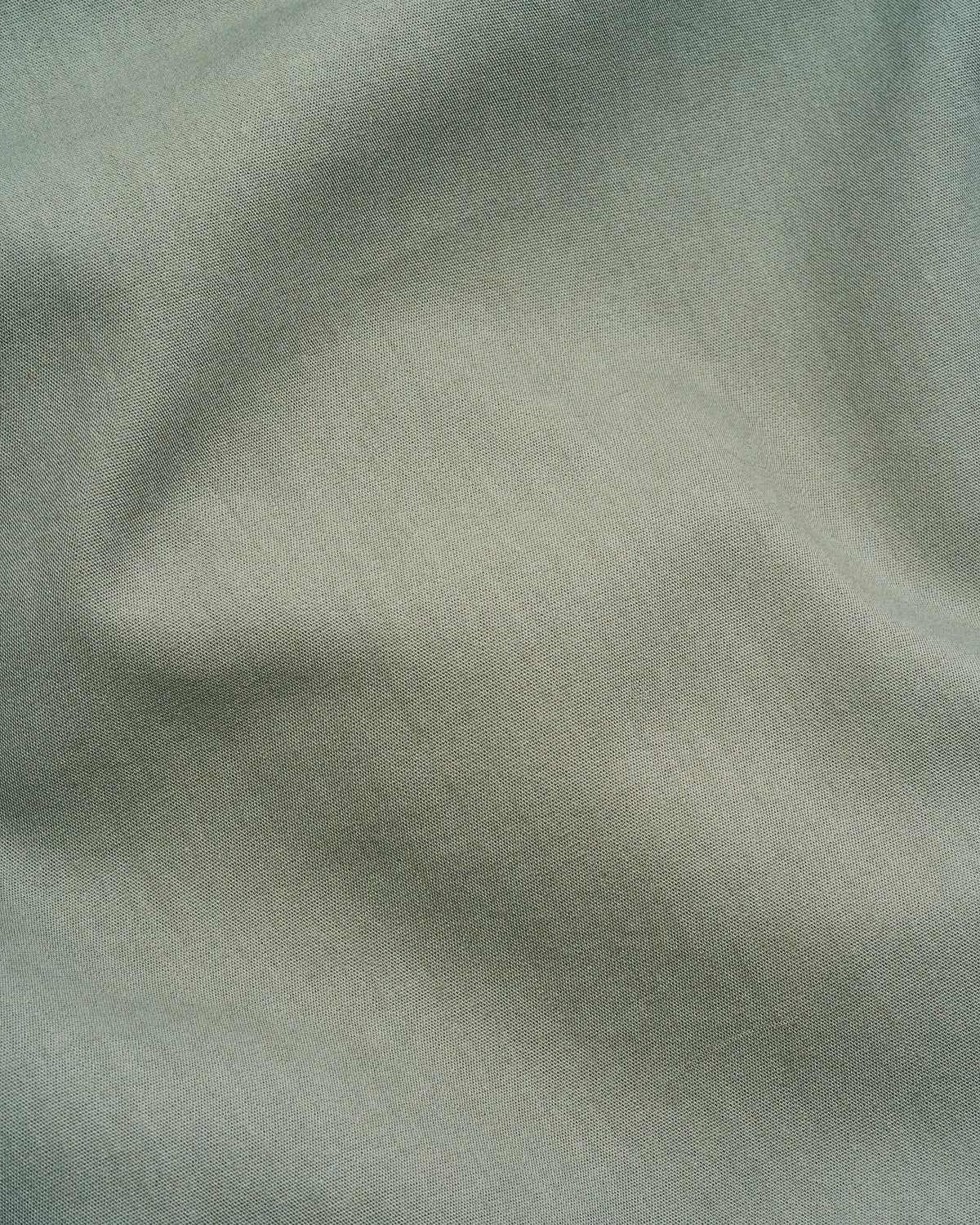 Signature Milk Fibre Core Set Highlands Green casein fabric closeup showing smooth lightweight texture