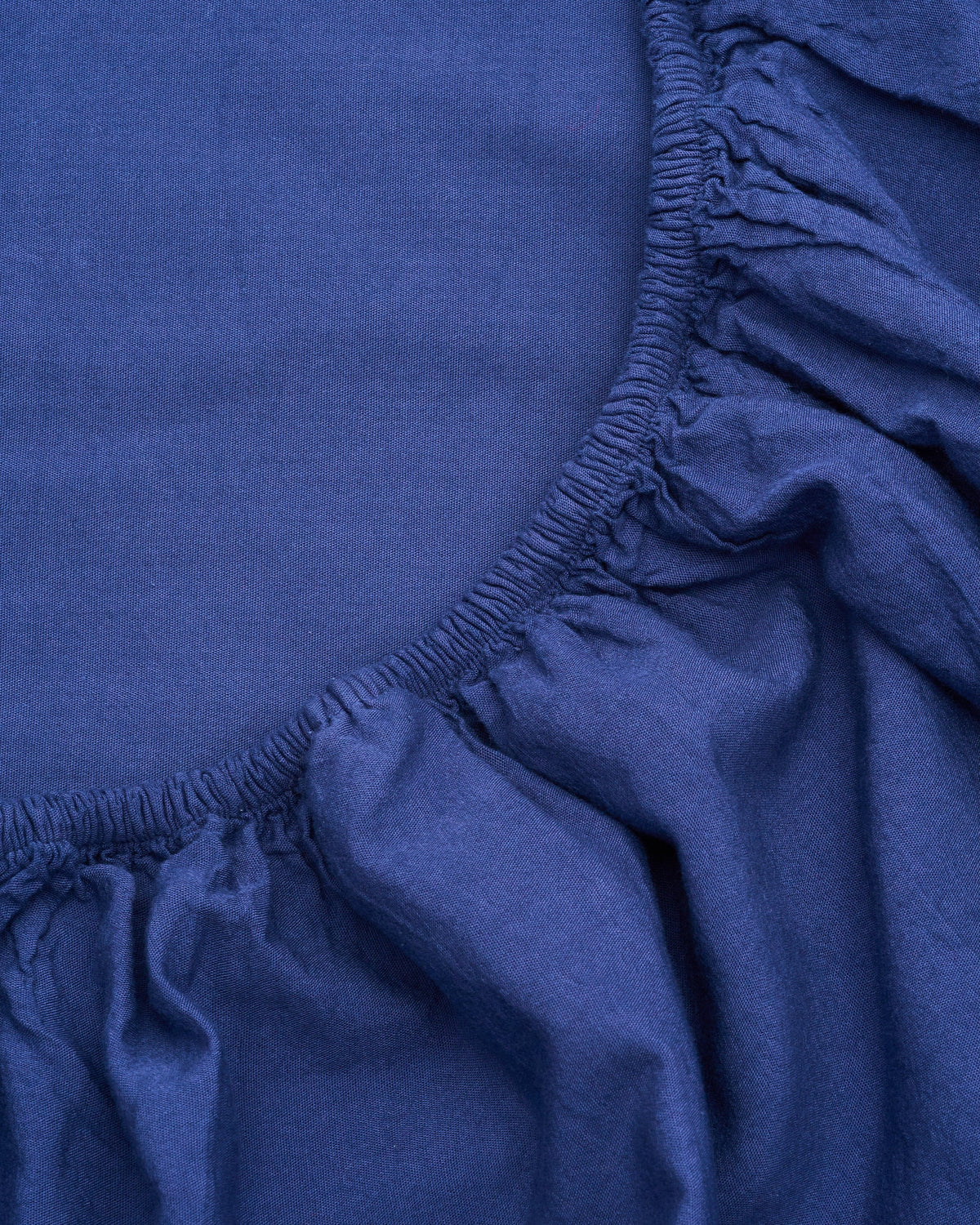 Signature Milk Fibre Core Set Lunar Blue fitted sheet elasticized corner detail showing fabric texture