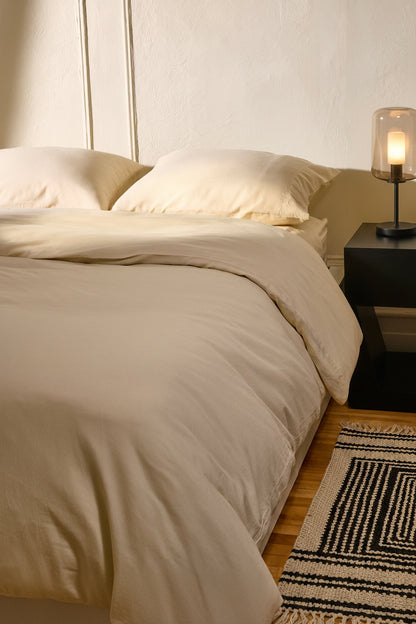 Signature Milk Fibre Deluxe Set in Cream with duvet cover and pillowcases on a styled bedroom bed