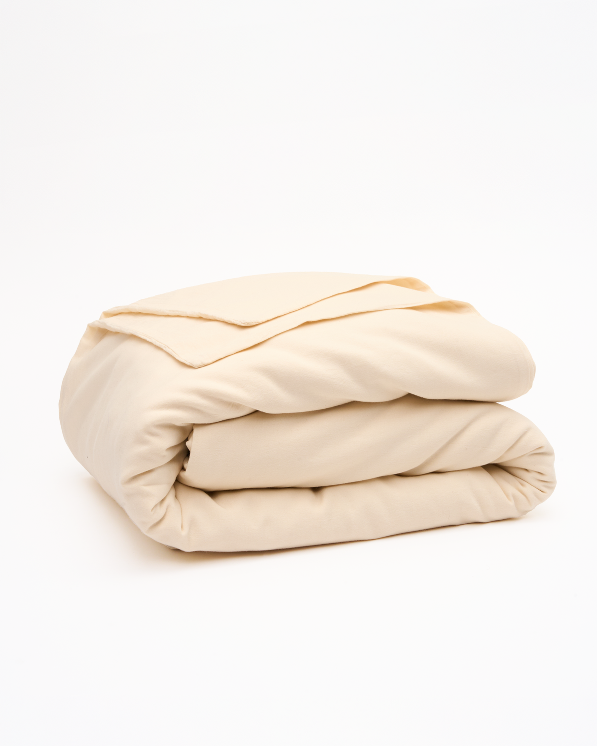 Signature Milk Fibre Deluxe Set Cream duvet cover folded on a white background