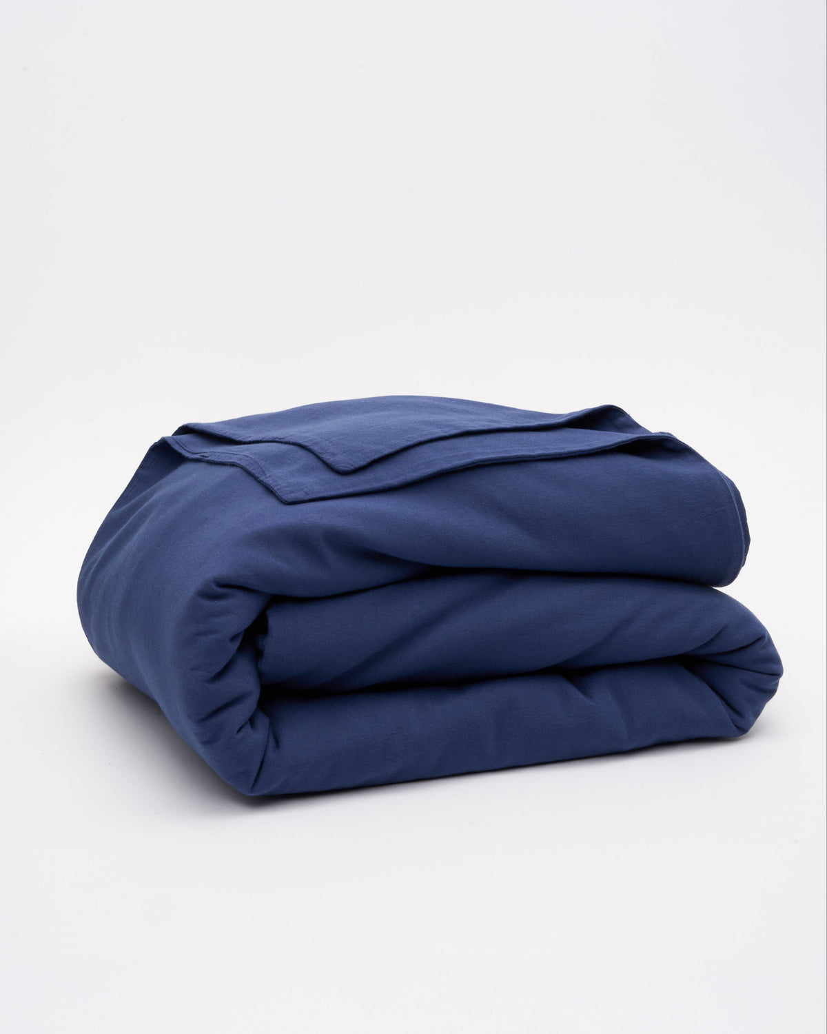 Signature Milk Fibre Deluxe Set Lunar Blue duvet cover folded on a white background