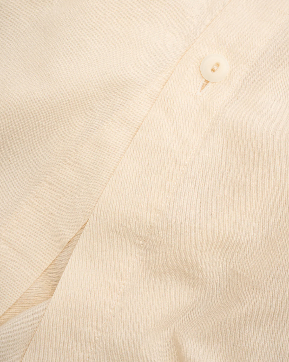 Signature Milk Fibre Duvet Cover Cream hidden button closure and knife-edge finish fabric detail closeup