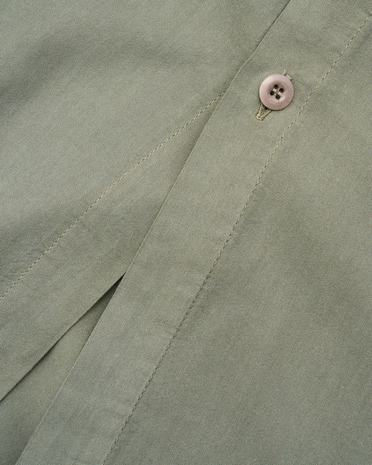 Signature Milk Fibre Duvet Cover Highlands Green hidden button closure and knife-edge finish fabric detail closeup