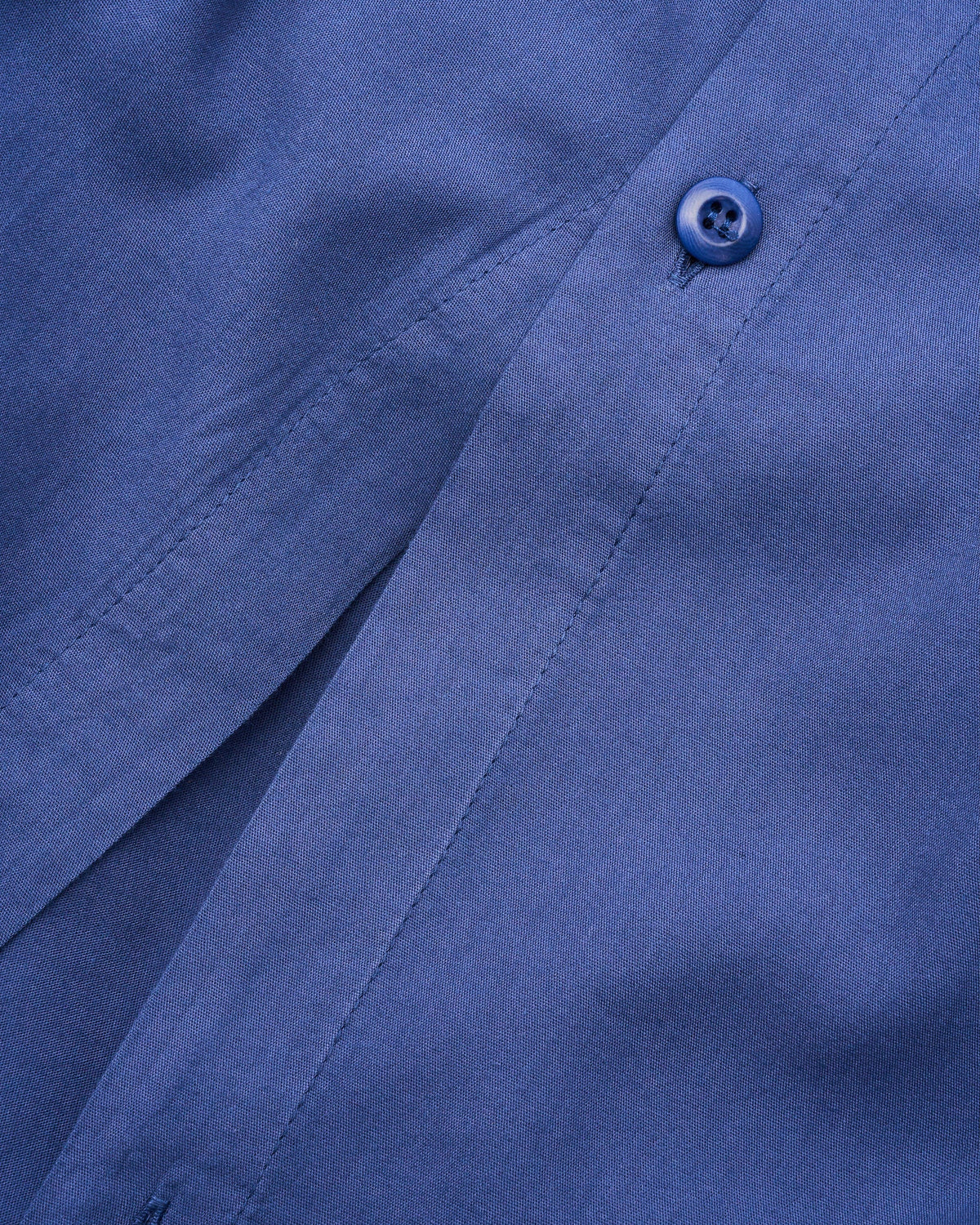 Signature Milk Fibre Duvet Cover Lunar Blue hidden button closure and knife-edge finish fabric detail closeup