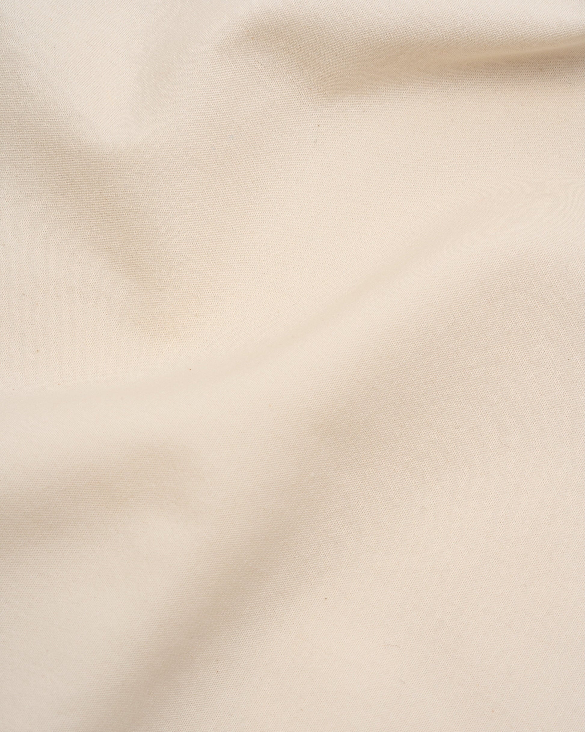 Signature Milk Fibre Sheet Set in Cream fabric texture close up soft drape detail