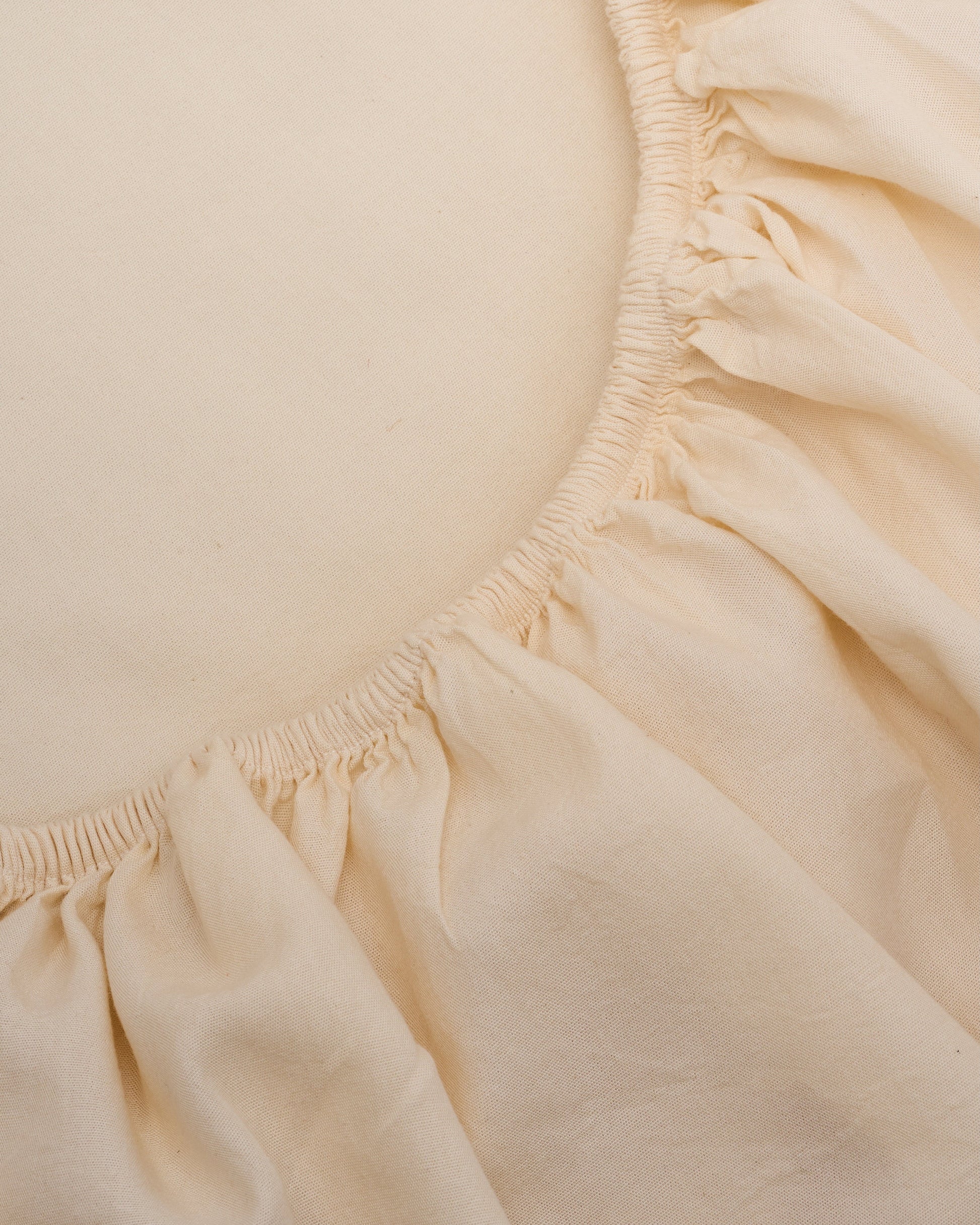 Signature Milk Fibre Sheet Set in Cream fitted sheet corner elastic detail close up
