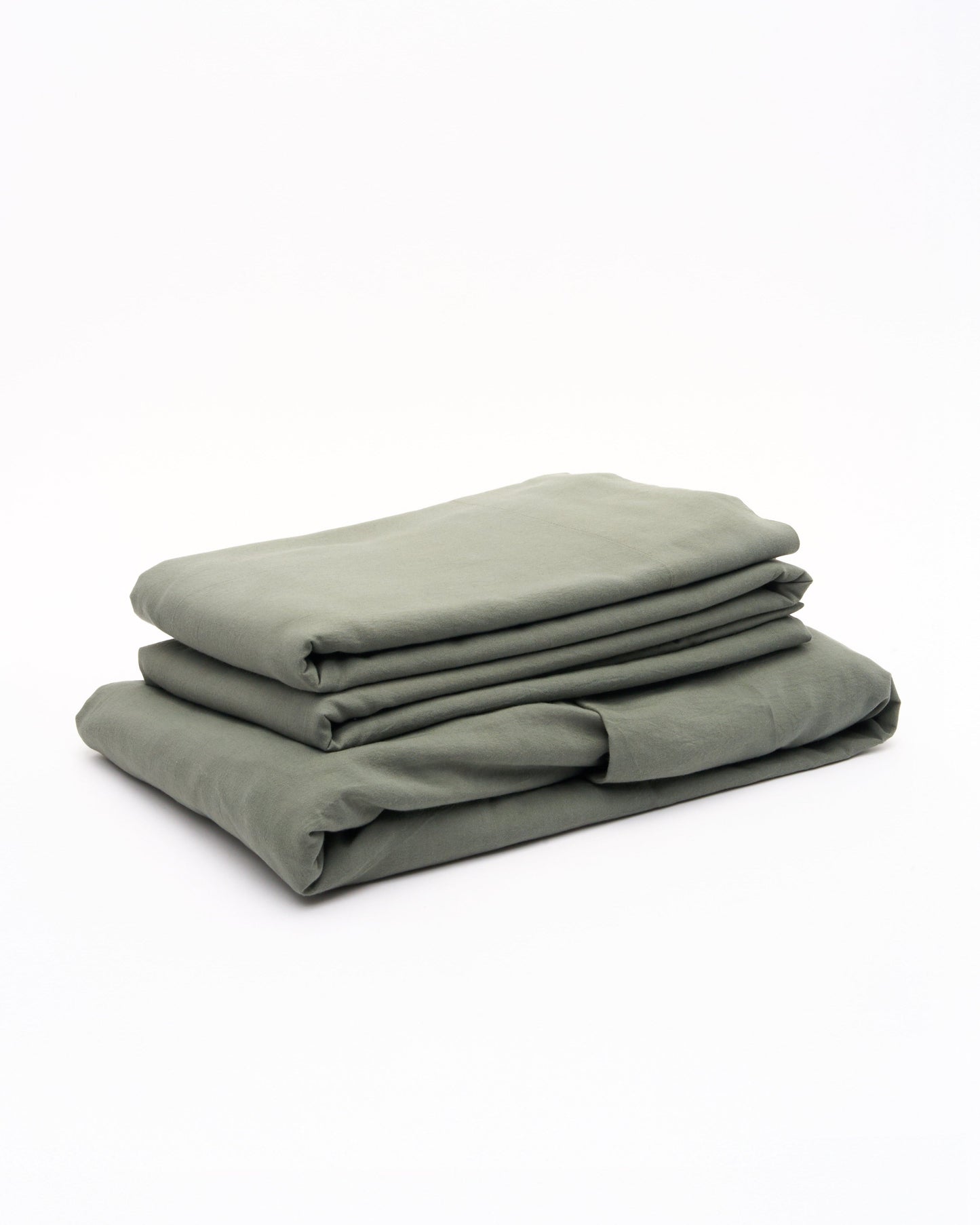 Signature Milk Fibre Sheet Set in Highlands Green folded stack on white background