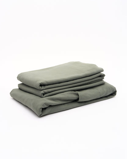 Signature Milk Fibre Sheet Set in Highlands Green folded stack on white background