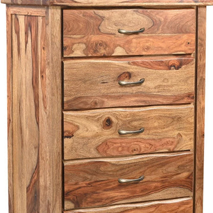 Upper four drawer faces of solid wood live edge chest showing auburn sheesham grain natural knots and antique brass cup pulls