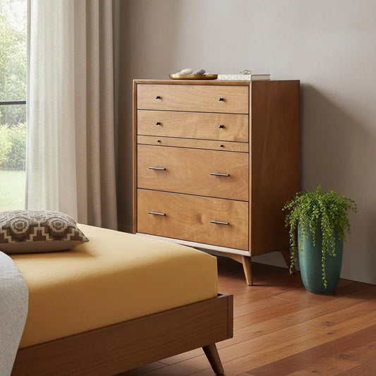 Solid mahogany four-drawer bedroom chest styled in warm bedroom setting with mid-century silhouette and metal handles
