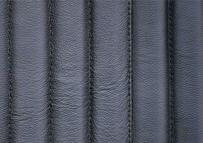 Stanford Genuine Leather Ribbed Headboard black top grain leather surface closeup showing natural grain texture and vertical ribbed stitching detail