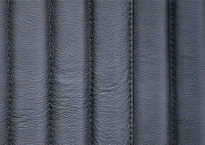Close-up of vertical ribbed genuine leather surface with stitched seam detail on the Stanford black leather chest