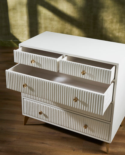 Stanford Ribbed Five-Drawer Leather Chest in white with top drawers open showing smooth micro-suede lined interiors and brass knobs on angled brass legs