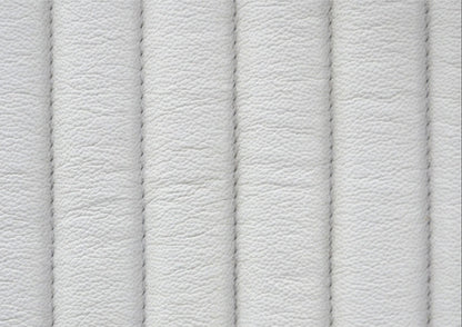 Close-up of vertical ribbed genuine leather surface with stitched seam detail on the Stanford white leather chest