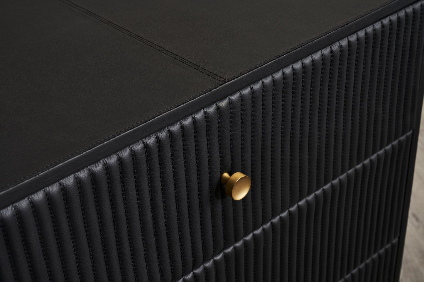 Stanford Ribbed Six-Drawer Leather Dresser black genuine leather ribbed texture brass knob close-up detail corner view
