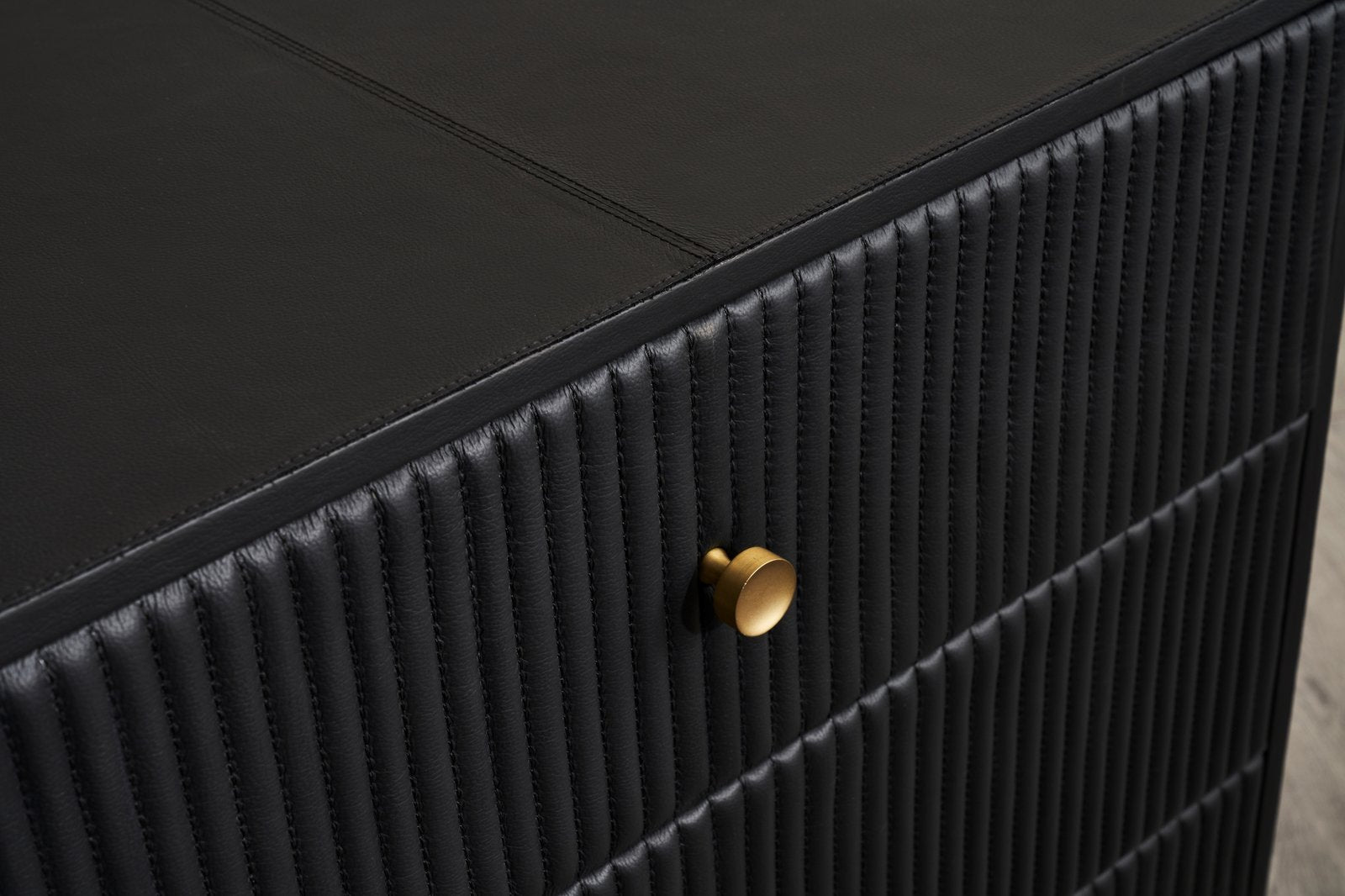Stanford Ribbed Six-Drawer Leather Dresser black genuine leather ribbed texture brass knob close-up detail corner view
