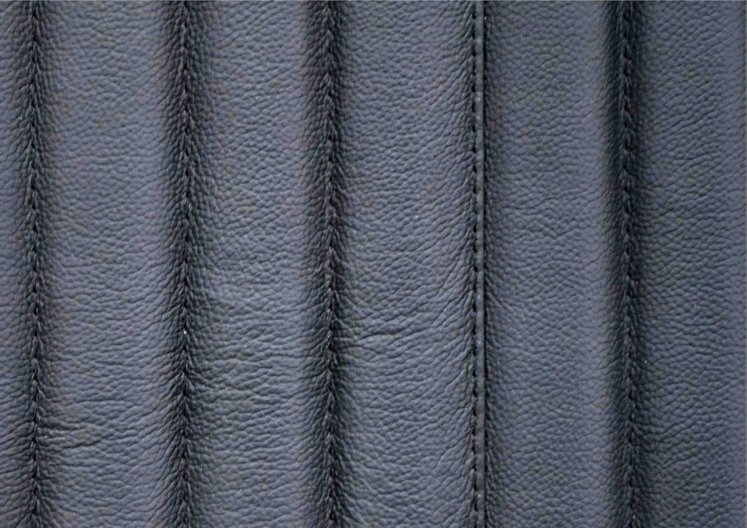 Stanford Ribbed Six-Drawer Leather Dresser black genuine leather vertical ribbing stitching texture macro close-upp