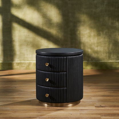Stanford Round Fluted Leather Nightstand black three drawers brass knobs brass rim base front view golden wall hardwood floor