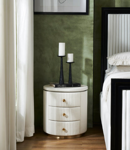 Stanford Round Fluted Leather Nightstand white candle holders book styled green bedroom beside fluted bed brass rim base side view