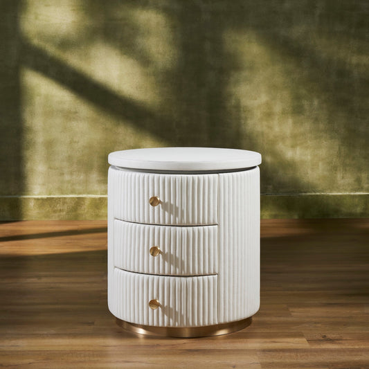 Stanford Round Fluted Leather Nightstand white three drawers brass knobs brass rim base front view warm green background hardwood floor
