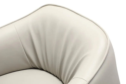 Detail view of the steel frame accent chair featuring soft light gray upholstery and a sleek tight back design.